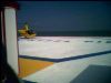 One of the first things we did is go on a pier.  I originally took this picture (through the fence) because you could see the ocean.  But then I noticed that little chopper that you can rent for tours, and I loved the colors in the shot with the ocean behind it.  The chain link acts as a frame on the left.